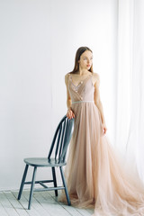 Fototapeta premium Bride in the interior Studio and minimalism. A classic European-style wedding.