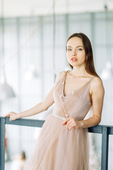 Naklejka premium Modern fashionable bride in the loft interior. Minimalistic wedding in European style.