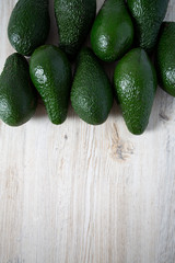 avocado on white wooden surface