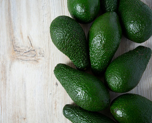 avocado on white wooden surface