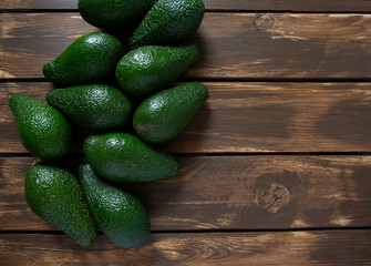 avocado on dark wooden surface