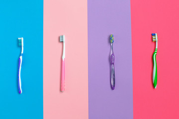 Set of different toothbrushes on color background. Hygiene of the oral cavity.