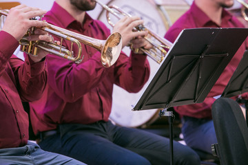 Obraz premium Attempt orchestra in culture house. Blowing instruments and peoples. Travel photo 2019.