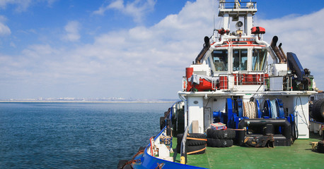 Obraz na płótnie Canvas Close-up of a supply vessel transporting cargo to nearby rigs