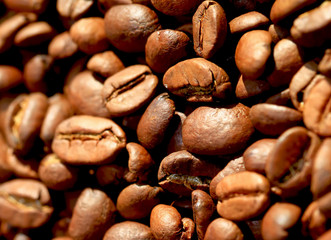 Fried coffee beans close-up - excellent morning breakfast. Black Espresso.