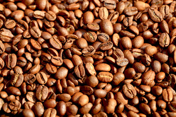 Fried coffee beans close-up - excellent morning breakfast. Black Espresso.