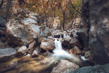 River long exposure waterfall in nature trees, forest and mountains in Paklenica National Park, Velebit, Croatia. Place for hiking and climbing tourism.