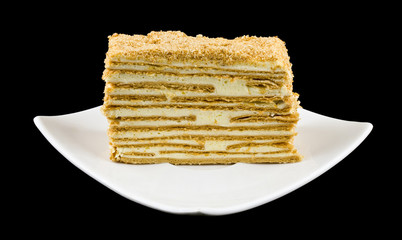 puff cake in a plate isolated on a black background