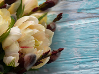 Fototapeta na wymiar Beautiful spring bouquet of tulips, copy space, blue background.