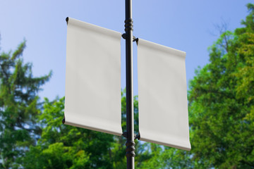 3D rendering of blank flag banner (empty advertisement) with clouds. Empty mockup template