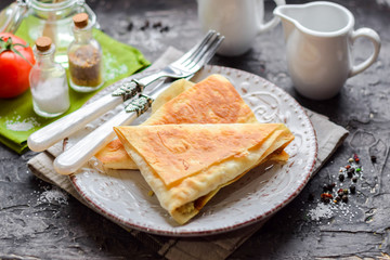 Triangles of pita bread with filling.