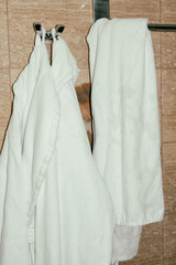 Rest in the hotel. Bathrobe in the bathroom.