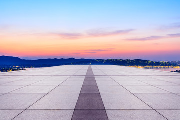 Empty square floor and beautiful mountain nature landscape at sunset