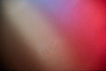 Blurred textural background with red brown blue and gray