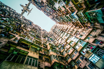 monster building in Hong Kong with airplane fly over