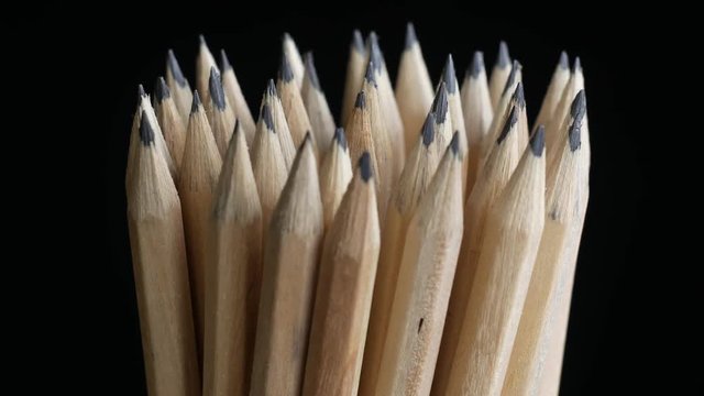 pencils turning on a black background