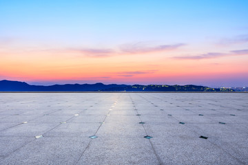 Fototapeta premium Empty square floor and beautiful mountain nature landscape at sunset