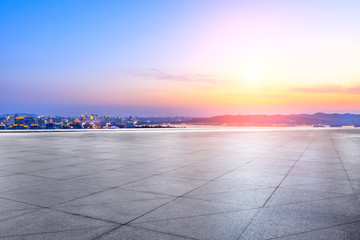 Empty square floor and beautiful city scenery with mountain in Hangzhou