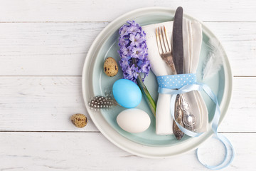 Easter place setting with easter eggs. Top view. Copy space.