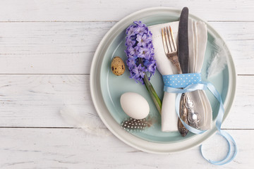Easter place setting with easter eggs. Top view. Copy space.