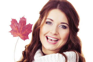 Smiling woman holding maple leaf