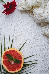 Flat lay with white background with Tropical fruits and flowers