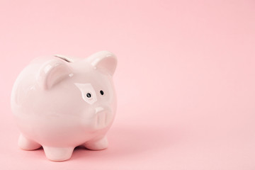 pink piggy bank on pink background