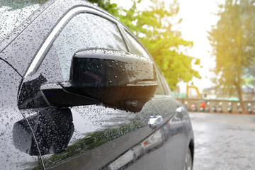 water rain drop on black modern vehicle car with glass coating glossy