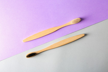 Toothbrushes on color background