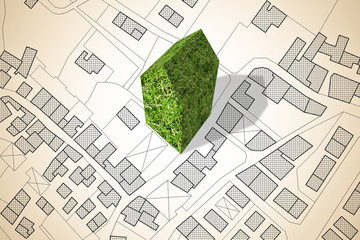 Imaginary city map with a green building - The architecture of the future - concept image