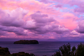 Dawn at Ventotene islands in Italy. Red clouds on sea.