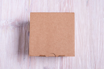 Cardboard box on wooden background