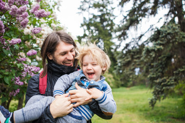 Fototapeta premium Father playing with son outside