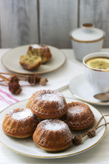 Lemon poppy biscuit muffins for tea on a light background.