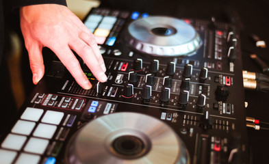 DJ plays and mix music on digital midi controller