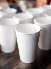 A group of empty coffee cups to serve tea or coffee at an event buffet