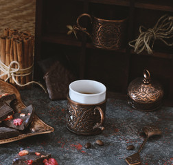 Chocolate and a Cup of coffee are on the table