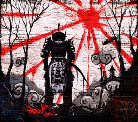 Graffiti on a brick wall of ronin lowered his head and stands against the sunset