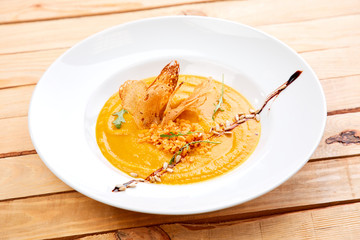 pumpkin cream soup with croutons and rice