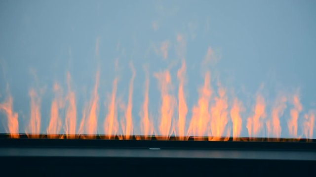 Artificial electrofireplace glowing backlight close-up.