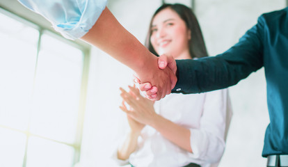 Business people shaking hands, finishing up a meeting In the office - Image