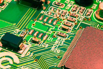 Electronic circuit board close up with different lighting.