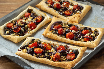 Eggplant puff pastry tarts with pomegranate and yoghurt.