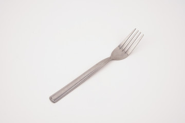 Steel silver fork isolated on white background