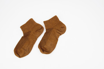 A pair of brown socks isolated on white background