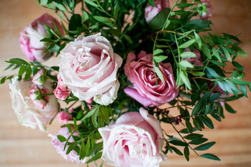 delicate bouquet of pink and beige peony and spray roses