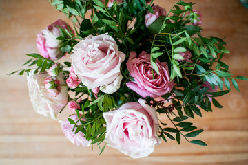 delicate bouquet of pink and beige peony and spray roses