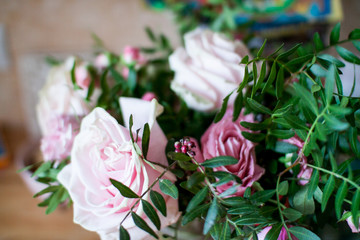 delicate bouquet of pink and beige peony and spray roses