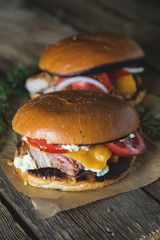 Cheeseburger with chopped meat, cheese and vegetables