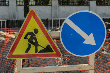 Road sign repair work and detour arrow